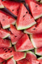 Fresh watermelon slices cut into triangular shapes