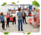 A group of Buddha Brands team members stand together in a factory plant, engaged in a discussion. 